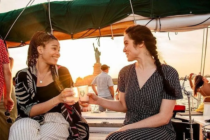 Schooner under sail at sunset on the Hudson, a sailing alternative to a New York architecture boat tour