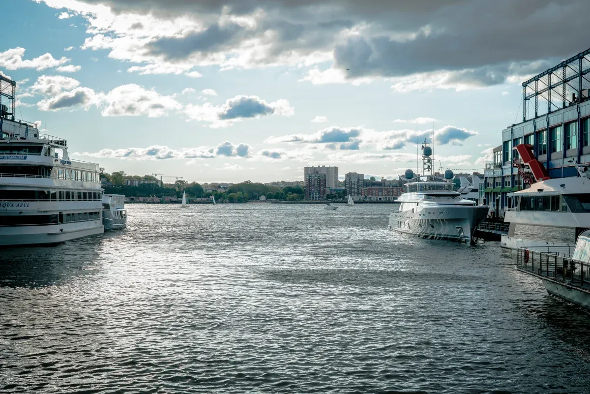 Yachts moored at Chelsea Piers on the Hudson, where harbor cruises like an architecture boat tour in New York depart