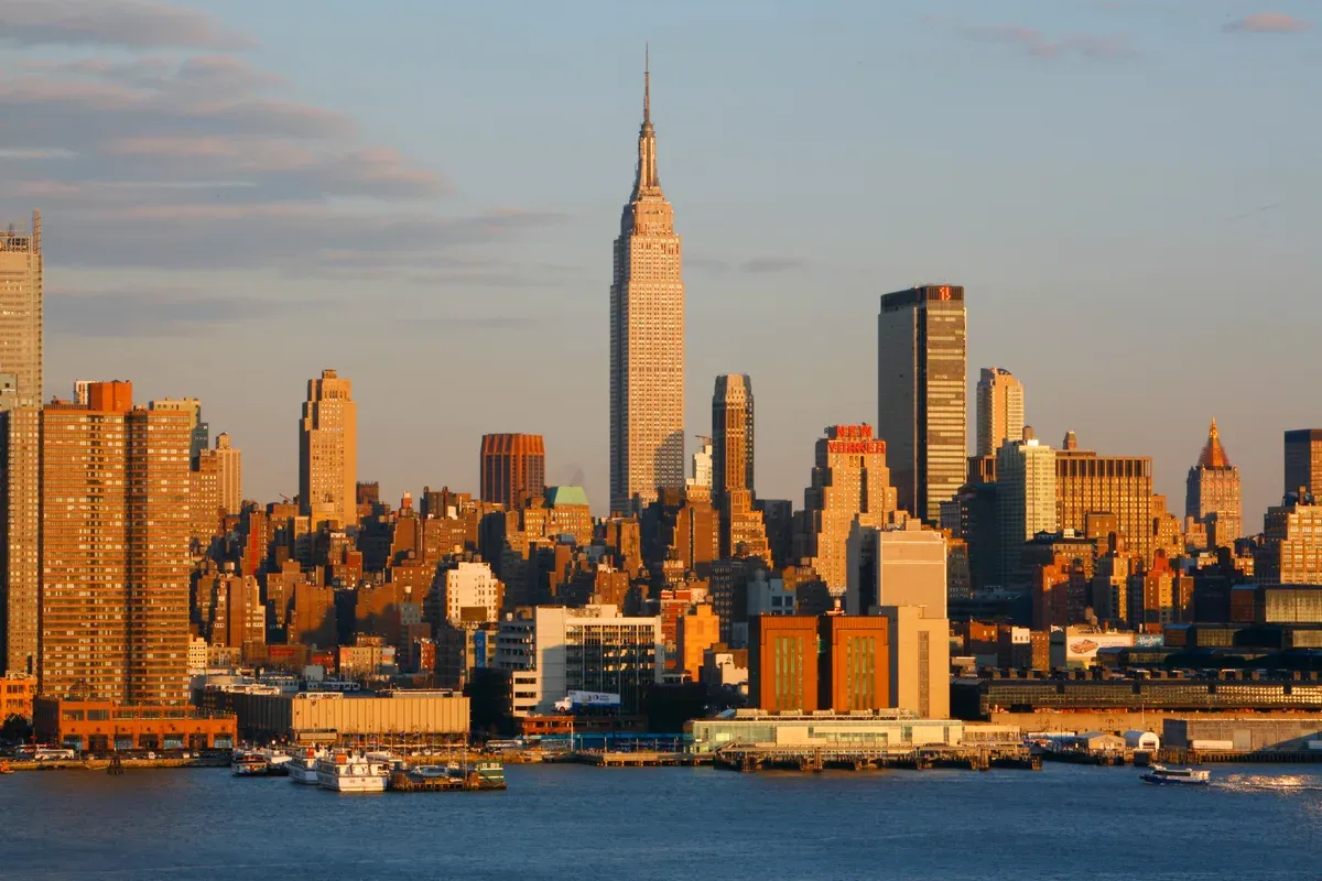 Midtown Manhattan skyline glowing at sunset over the Hudson, the view on an architecture boat tour in New York