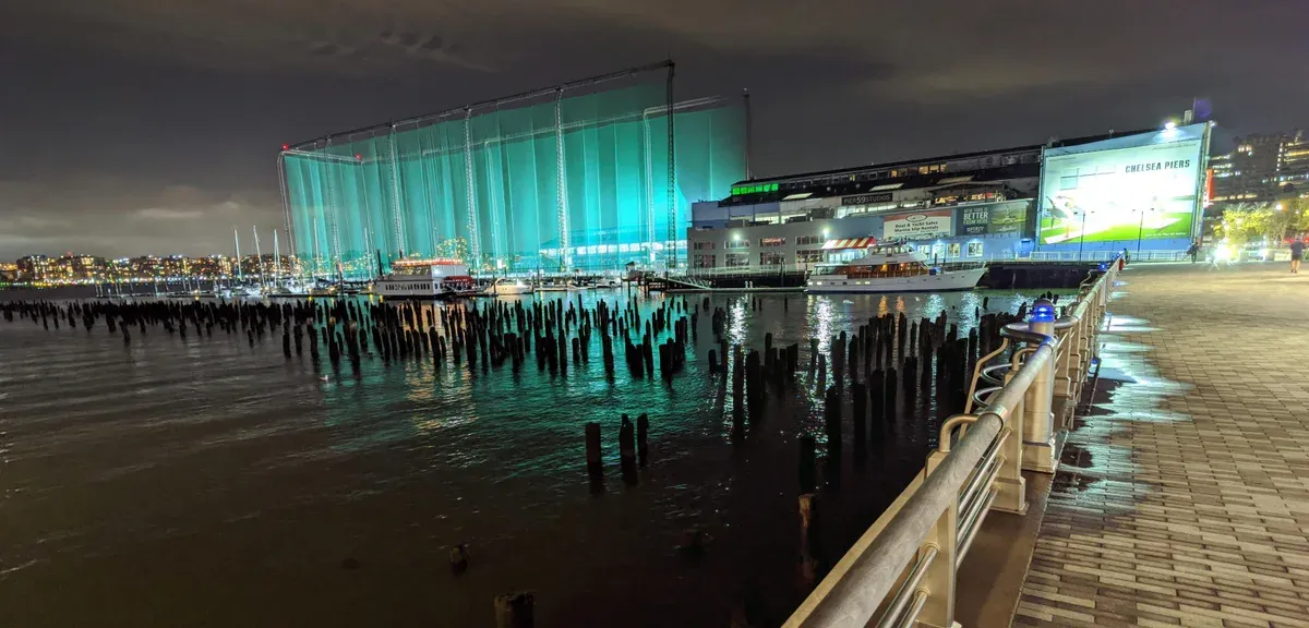 Chelsea Piers waterfront at night, departure point for an architecture boat tour in New York